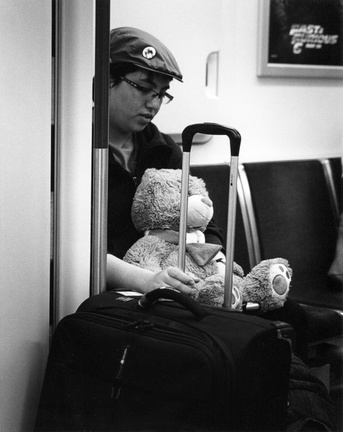 Guy with a teddy bear on the subway (105560-12)